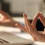 Hands of an office worker, meditating in the office.